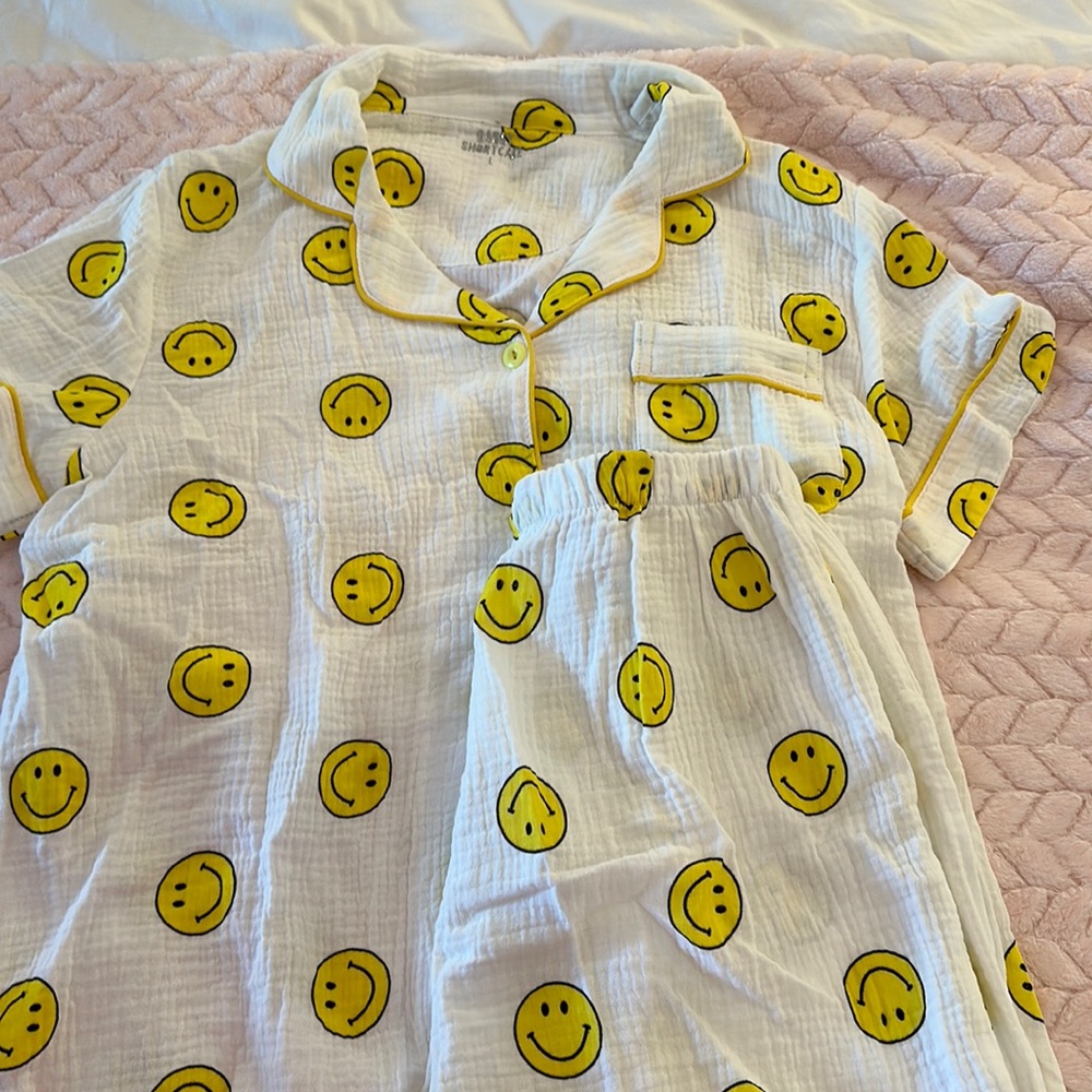 white pjs with smiley faces on them